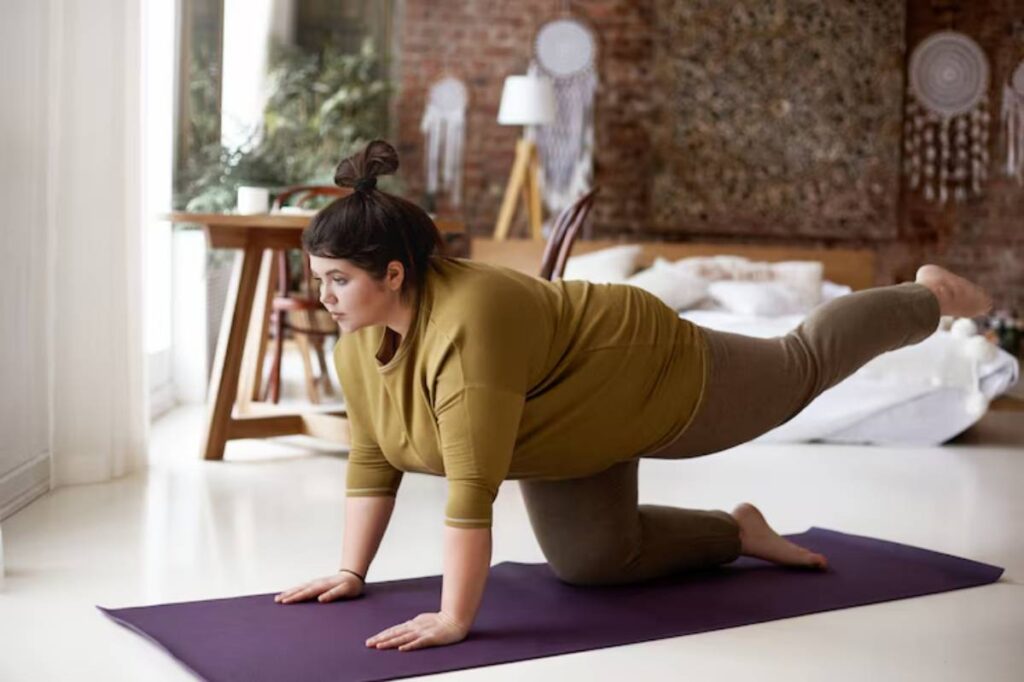 A person on a purple mat, doing exercise in a bright, modern living space.