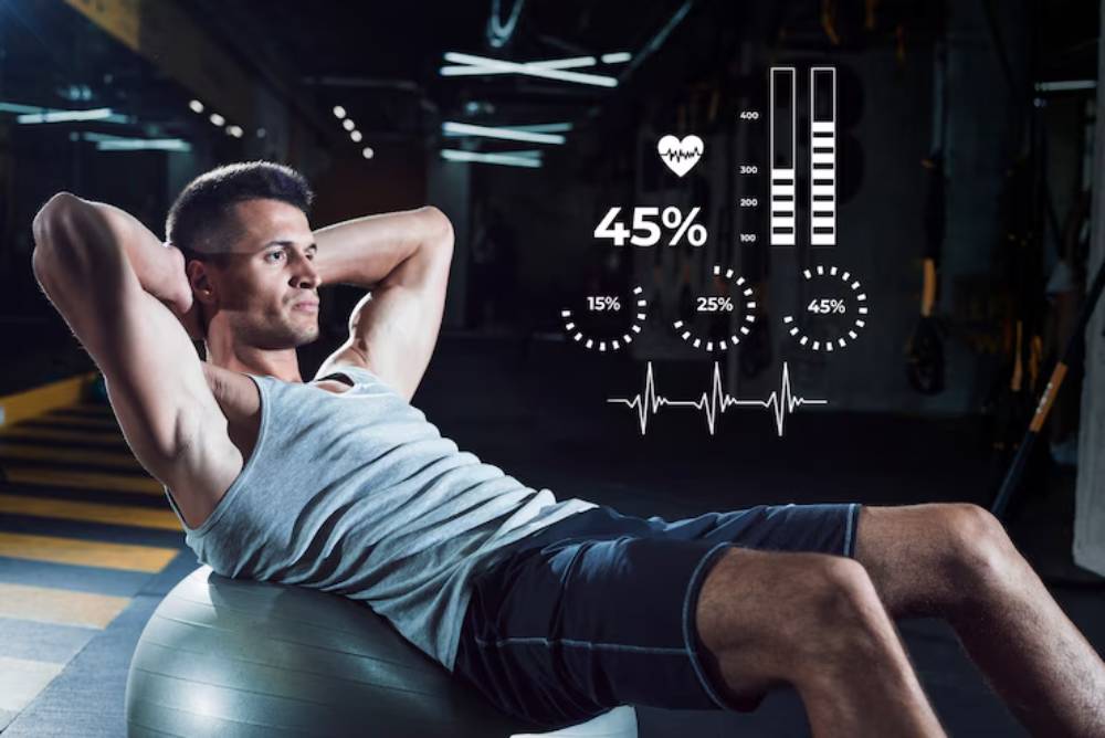 A person performs crunches on a fitness ball in a gym, with health metrics displayed, including heart rate and workout intensity.